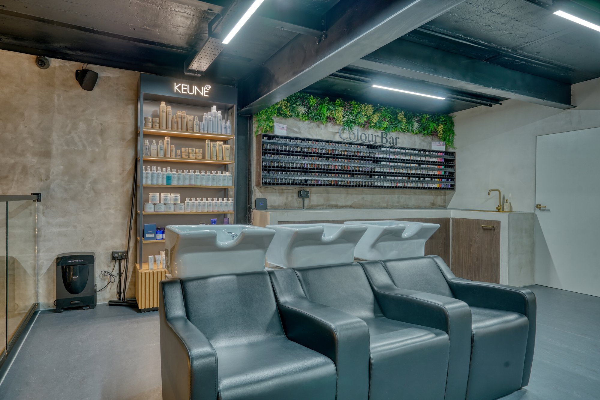 Wash stations and colour bar at Avesta Hair Academy, Salford