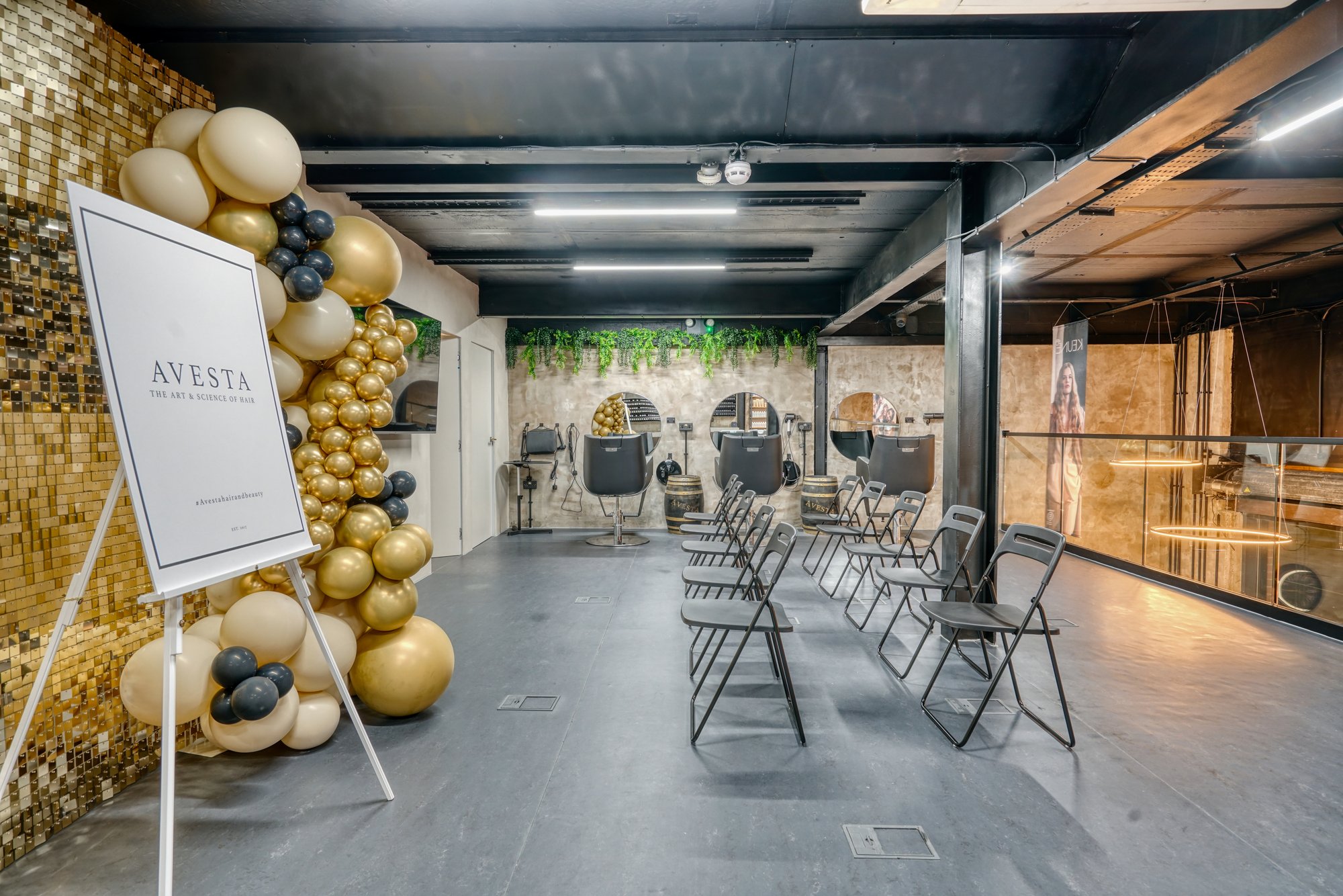 Academy training floor with styling stations at Avesta Hair, Salford