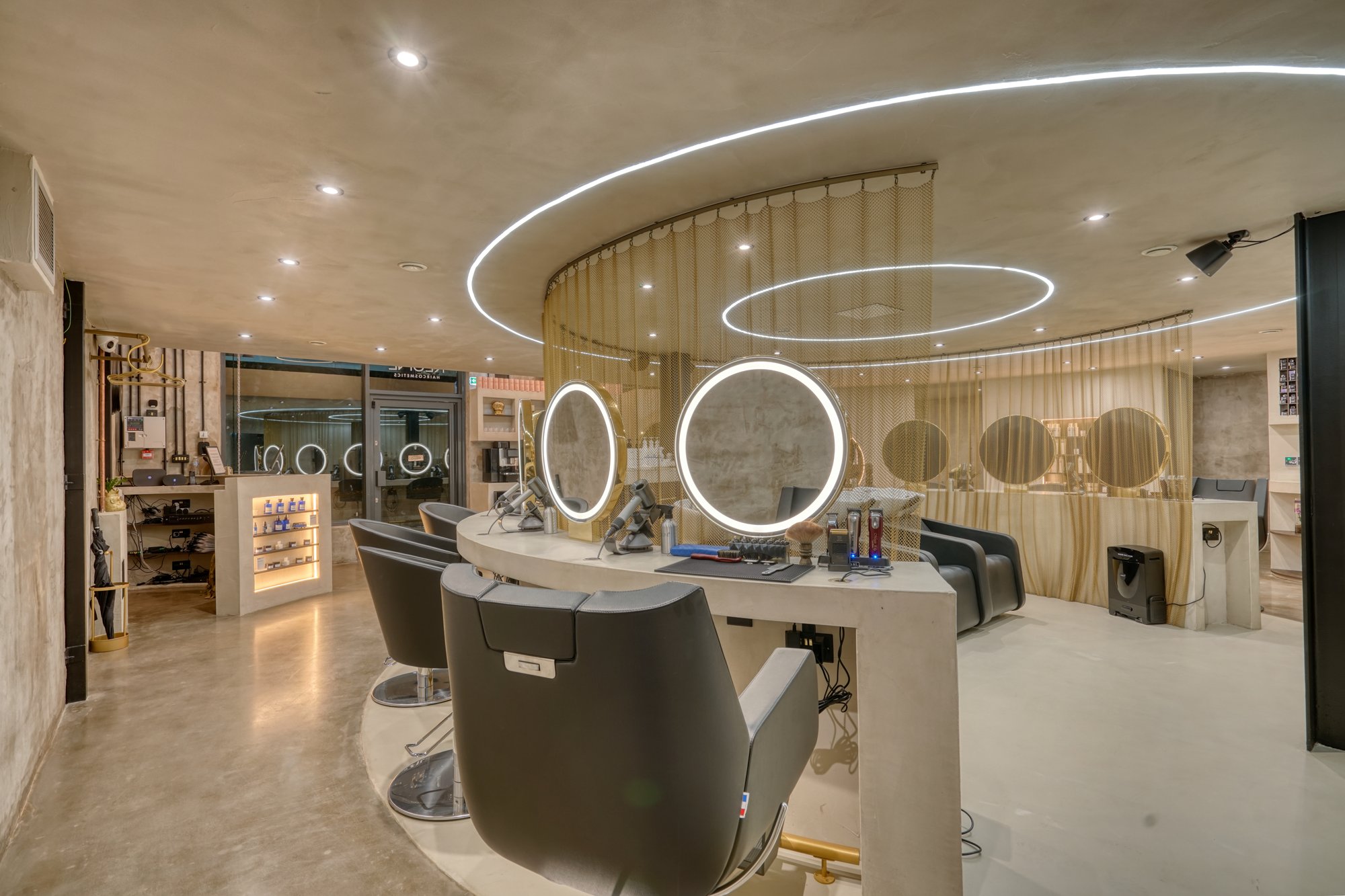 Styling stations with circular LED mirrors at Avesta Hair, Salford